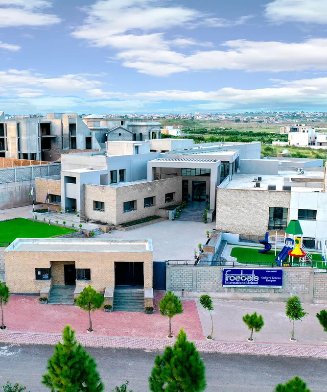Aerial view of the Gulberg Greens campus, with its lawns and playground.